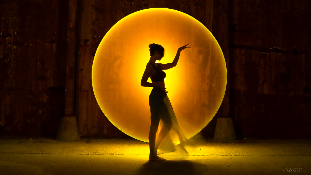 A woman in front of an Auto Draft light.