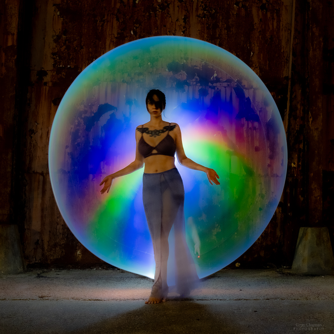 A woman with colorful bubble ball.